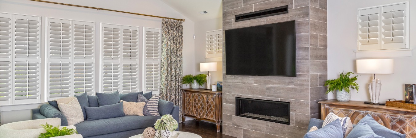 Plantation shutters in Waterbury family room with fireplace