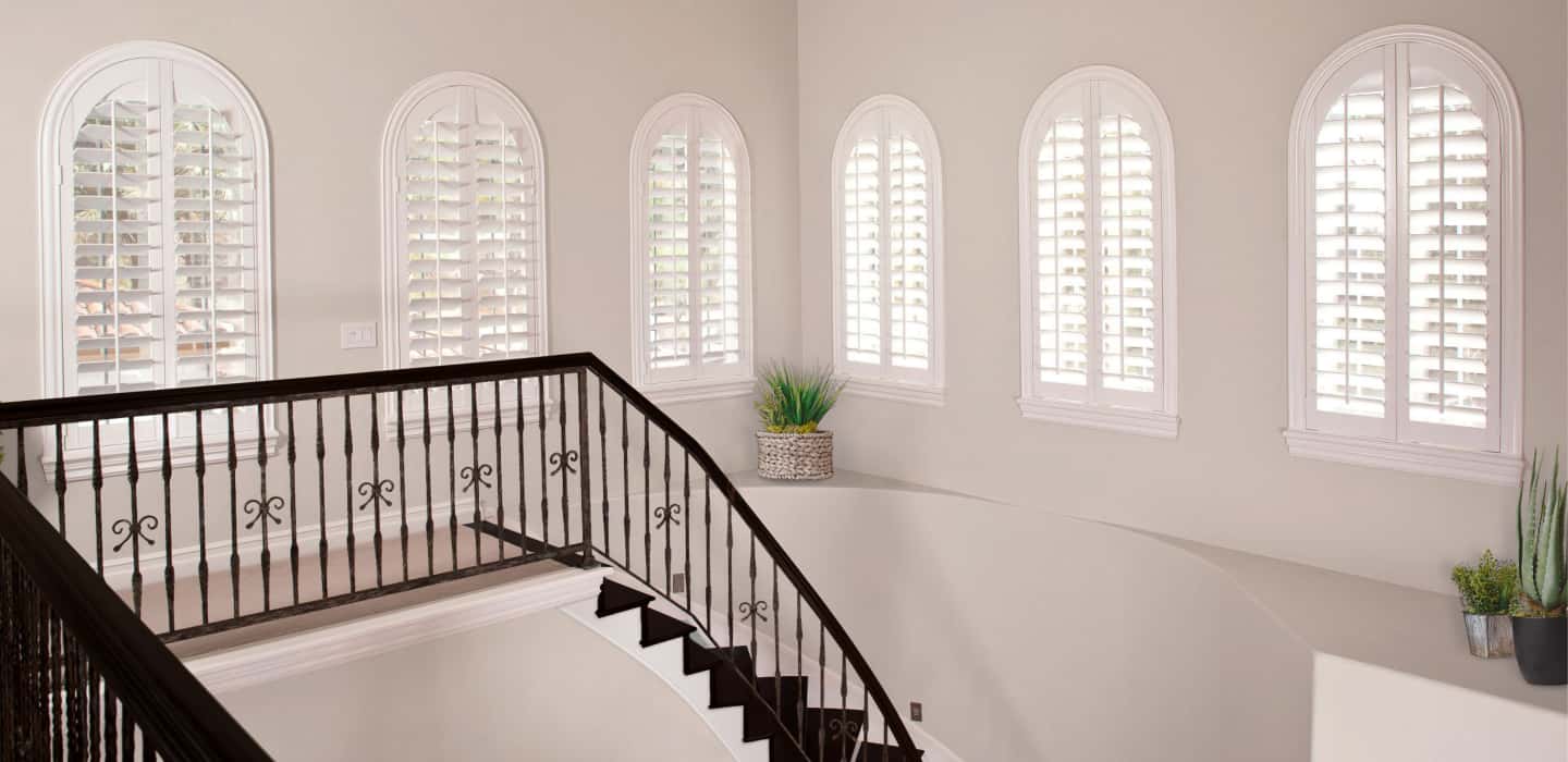 Custom treatments completely cover your window and smoothly open and close. Arched Plantation Shutters