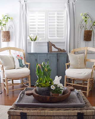 White shutters in airy sunroom.