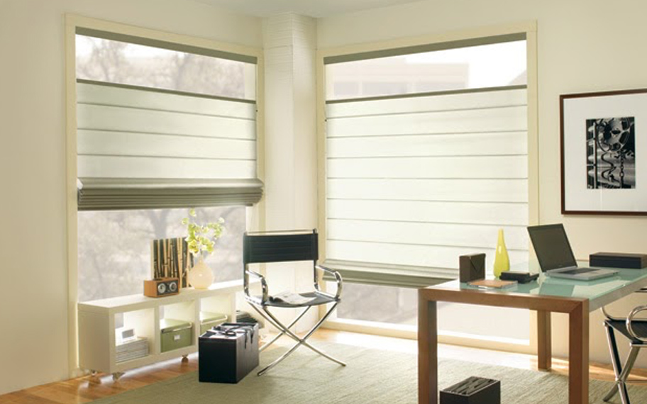Upgrade your windows with stylish window shades or shutters in Hartford. Stylish sheer shades in the corner of a modern office.