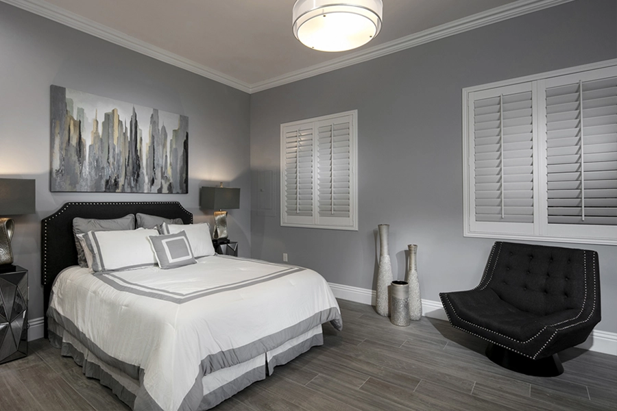 Close your custom Polywood shutters to beat the heat and keep your Hartford bedroom cool. White Polywood shutters on bedroom windows