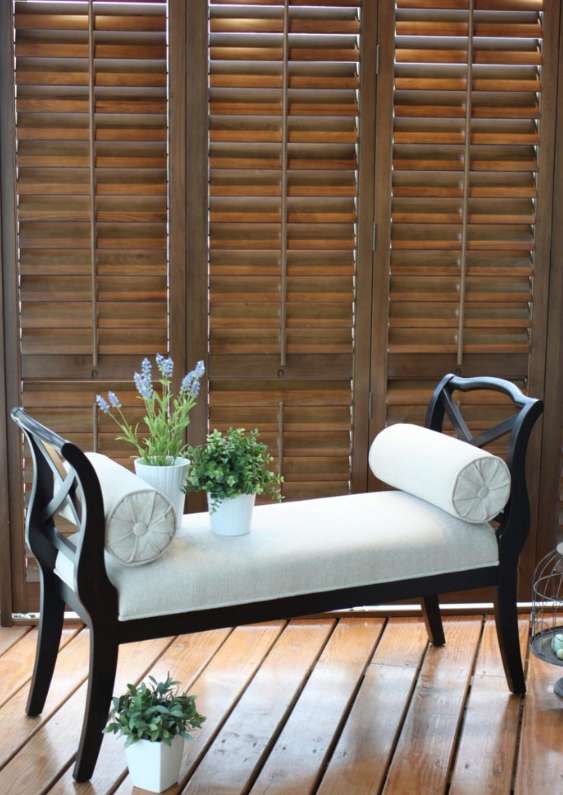 Ovation shutters behind a bench
