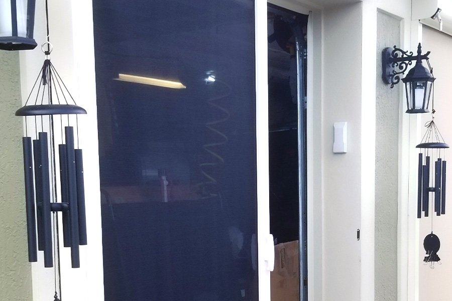 Medium sized retractable door with black screen and white trim