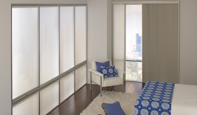 Cellular shades are another option to reflect a minimalist design. Cellular shades in a streamlined bedroom.