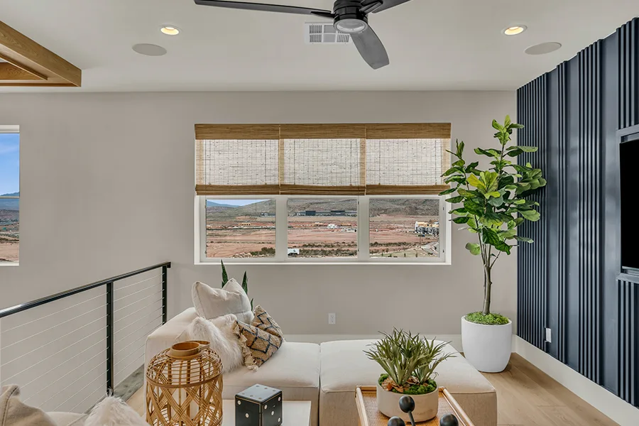 Hartford homeowners who want eco-friendly home fixtures should consider natural woven shades. Natural brown woven shades on a window in a stylish sitting area