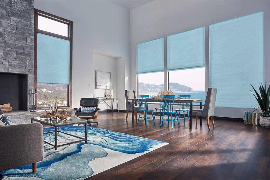 Smart motorized window shades are perfect on tall windows in your Hartford home. Blue motorized shades on tall living room windows