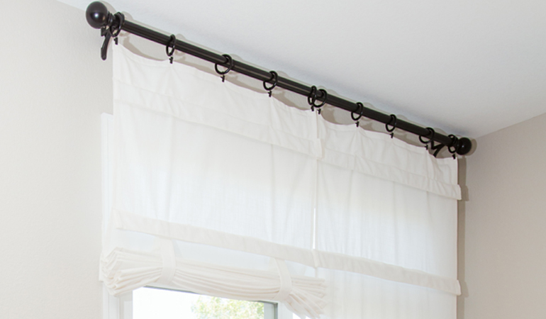 Tumble shades in Hartford give your doors privacy versatility and style. White tumble shade on double glass doors